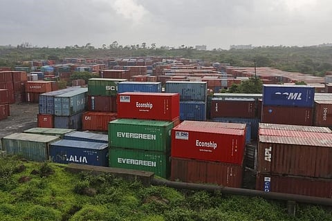 Cargo containers are seen stacked outside the container terminal of Jawaharlal Nehru Port Trust (JNPT) in Mumbai, India. (File photo | Reuters)
