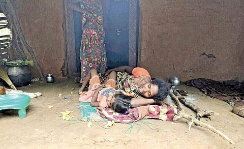 A woman and her child suffering from viral fever wait for medical aid in Chaparai village of East Godavari district. Officials had, so far, tried to downplay the spike in the number cases of communicable diseases in the region | Express Photo Service