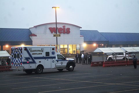 An ambulance waits outside of a Weis Market, the scene of a shooting in Tunkhannock, Pa., on Thursday, June 8, 2017.(AP)
