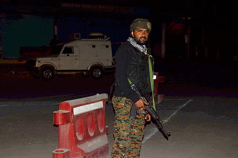 Security person stand guard after militants opened fire on the Amarnath Yatra in which some pilgrims were killed many injured in Anantnag in Jammu and Kashmir on Monday. | PTI