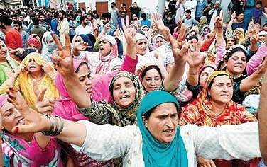 Women shouting slogans during funeral prayers for one of the three militants killed in the overnight encounter with security forces in Budgam district, at Hyderpora in Srinagar on Wednesday| PTI