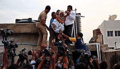 ‘Traffic’ Ramaswamy being forcefully brought down from the terrace of a building in Chennai on Saturday | Romani Agarwal
