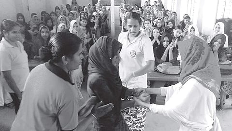 Women police officers giving training in self-defence to students at Subulussalam Higher Secondary School in Malappuram