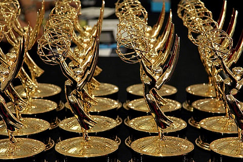 Statues of the 64th Emmy awards being displayed on a table backstage. (Photo| AP)