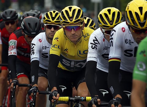 Britain's Geraint Thomas wearing the overall leader's yellow jersey, center, ride in the pack during the second stage of the Tour de France cycling race with start in Dusseldorf, Germany, and finish in Liege, Belgium | AP