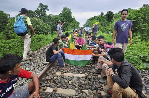 Agartala Indigenous People Front of Tripura IPFT and other tribal wings go on a road and rail blockade movement to demand a separate state- Tipraland in the outskirts of Agartala. (File photo by PTI)