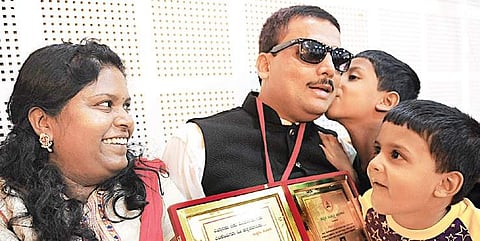 Kempahonnaiah with his wife and children after felicitation in Bengaluru | NAGESH POLALI