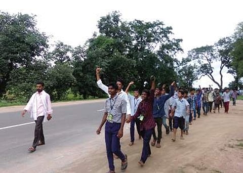 Students walk to ITDA office, Utnoor from Girijana Ashram school Yanda as a protest in Adilabad on Thursday | Express photo