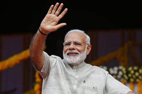 Prime Minister Narendra Modi attends an event a day ahead of the implementation of the nationwide Goods and Services Tax (GST) in Ahmadabad, India, Friday, June 30, 2017. The single, nationwide tax starting Saturday replaces a complicated mix of state and