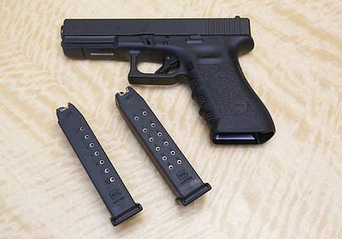 In this Tuesday, June 27, 2017 photo, a semi-automatic hand gun is displayed with a 10 shot magazine, left, and a 15 shot magazine, right, at a gun store in Elk Grove, Calif. (File | AP)