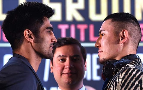 WBO Asia-Pacific Super Middleweight champion Vijender Singh (L) and his competitor WBO Oriental Super Middleweight champion China's Zulpikar Maimaitiali | AFP