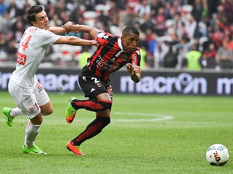 Dalbert Henrique (R) played 33 matches in Ligue 1 last season as Nice finished a surprise third behind Monaco and PSG. | AFP