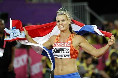 Netherlands' Dafne Schippers celebrates after winning the gold medal in the women's 200m final during the World Athletics Championships in London.| AP