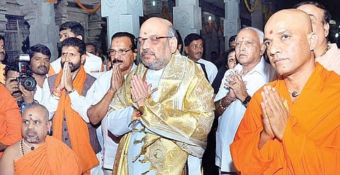 BJP national president Amit Shah, Union Minister D V Sadananda Gowda and BJP leader CT Ravi offering prayers at Adichunchanagiri Mutt in Mandya on Sunday