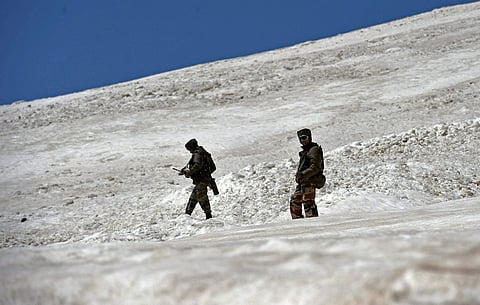 Army soldiers petrol in the snow bound Zojila Pass situated at a height of 11,516 feet on its way to frontier region of Ladakh in Zojila. | PTI File Photo