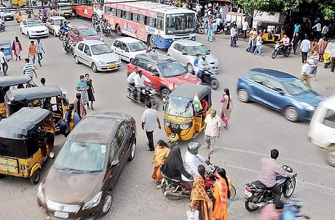Commuters finding difficult to cross the road due to the ongoing metro rail works at Amerpeet in Hyderabad on Tuesday | sayantan ghosh
