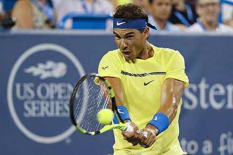 Rafael Nadal, of Spain, returns to Richard Gasquet, of France, during the middle rounds at the Western and Southern Open tennis tournament. | AP