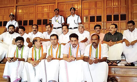 UDF MLAs and senior Congress leaders staging a sit-in protest at the entrance of the Assembly Hall | Express