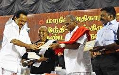 Stalin being handed over a copy of a book on Thanthai Periyan during the conference in the city on Friday | ashwin prasath