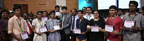 Health Secretary J Radhakrishnan and the top rankers with their medical seat allotment orders, during the first day of medical counselling.| Express