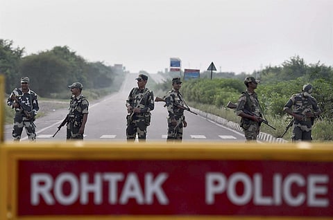 Security Personnel keeping strict vigil near Suniari Jail in which Dera Sacha Sauda Chief Ram Rahim s quamtum of punishment be awarded in Rohtak on Sunday . | PTI