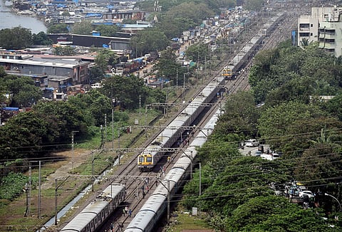 A view of the queued up local trains on railway tracks as the suburban train services remain disrupted after heavy rains in Mumbai on Wednesday. | PTI