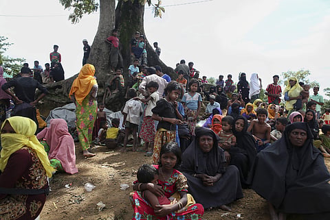 Myanmar's Rohingya Muslim ethnic minority members wait to enter the Kutupalong makeshift refugee camp in Cox's Bazar, Bangladesh, Wednesday, Aug. 30, 2017.(AP)