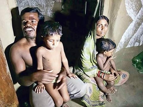 The family of Nirakar at their home | EXPRESS