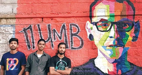 Artists Arjun Raj, Sreekumar and Vishnu Ambat with their graffiti ‘Numb’ — a tribute to Chester Bennington of Linkin Park band — at Jyoti Nivas College, Koramangala, Bengaluru
