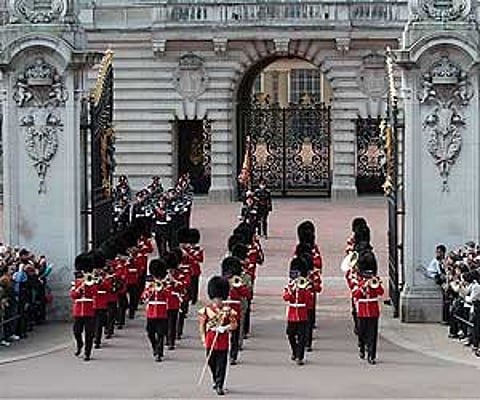 A British army band marches for the Changing of the Guard outside Buckingham Palace, in central London. AP File Photo