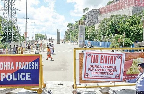 Head Water Works Road closed at Durga Ghat in view of the construction of the Kanaka Durga flyover in Vijayawada on Monday | Express