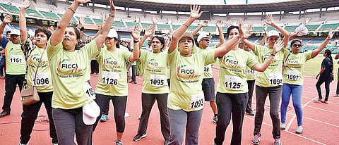 Participants warm up before the run P Jawahar