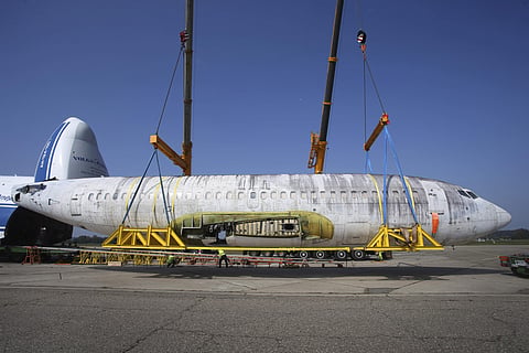 The fuselage of Lufthansa plane 'Landshut' is unladed from a Russian Antonov transport plane at the airport in Friedrichshafen. (Photo | AP)
