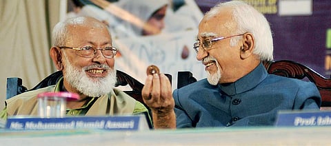 Former Vice-President Mohammad Hamid Ansari sharing a light moment with Institute of Objective Studies chairman M Mansoor Alam during the international conference on 'The role of woman in making a humane society' in Kozhikode on Saturday | A Sanesh