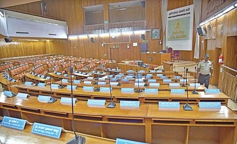 A BBMP staffer checks the seating arrangement made at the BBMP Council hall on Tuesday for the mayoral elections | NAGARAJA GADEKAL