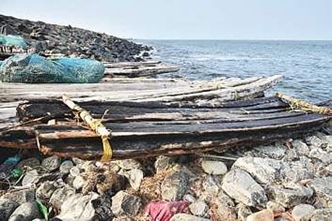 Makeshift boats soaked in oil that are still used by small-time fishermen at Bharathiyar Nagar | p jawahar
