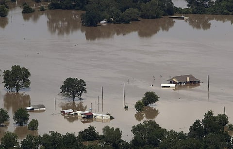 Homes are surrounded by water from the flooded Colorado River in the aftermath of Hurricane Harvey on Sept. 1, 2017, near Wharton, Texas. (File photo | AP)