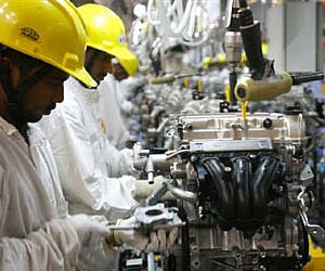 Employees work inside Maruti Suzuki's petrol engine plant. (File photo/Reuters)