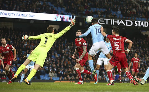 Manchester City's Sergio Aguero scores his sides second goal during the English League Cup semifinal against Bristol City | AP