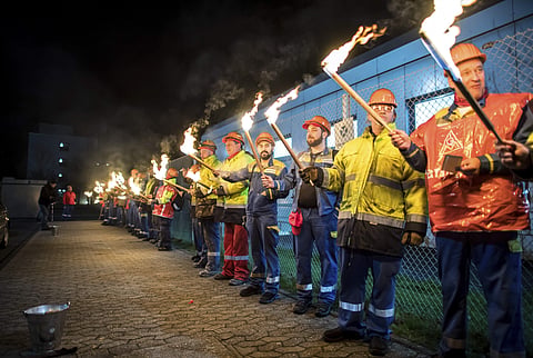 The night shift workers meet for a warning strike assembly of the IG Metall (Industrial Union of Metalworkers) in front of the gates of the Aluminium Norf GmbH in Neuss, Germany, Tuesday, Jan. 9, 2018. (Photo | Associated Press)