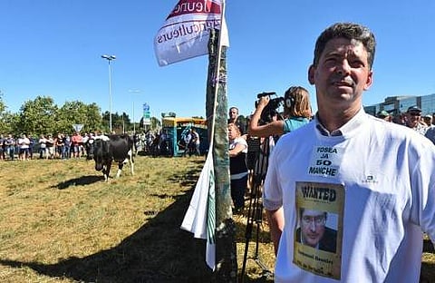 A regional federation of farmer union member wearing a tee-shirt bearing a picture of Emmanuel Besnier (File | AFP)