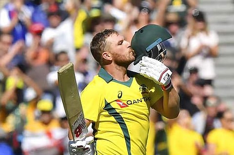 Australia's Aaron Finch celebrates scoring a century against England during their ODI cricket match in Melbourne in Australia on Sunday | Photo: AFP