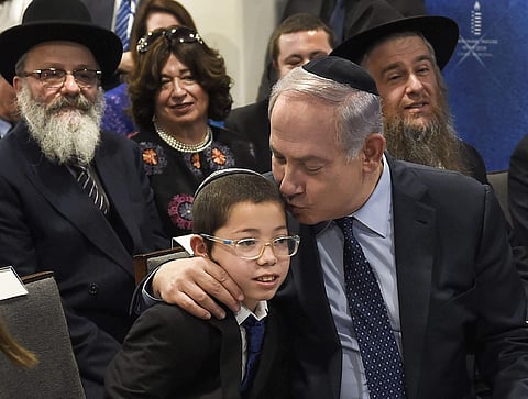 Israeli Prime Minister Benjamin Netanyahu with Mosche Holtzberg and his grand-parents after unveiling the Living Memorial in commemoration of the victims of the 26/11 attacks at the Chabad House in Mumbai on Thursday. (PTI)