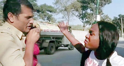 A Congolese student attacking a cop after being questioned for reckless driving at HBR Layout in Bengaluru recently