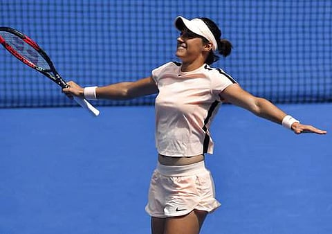 France's Caroline Garcia celebrates after defeating Aliaksandra Sasnovich of Belarus in their third round match at the Australian Open tennis championships in Melbourne. | Photo: AP