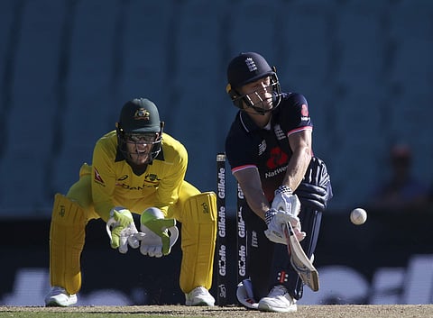 England's Chris Woakes plays a sweep in front of Australia's Tim Paine during their one day international cricket match in Sydney, Sunday, Jan. 21, 2018. | AP