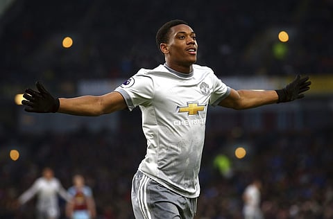Manchester United's Anthony Martial celebrates scoring his side's first goal of the game during their English Premier League soccer match against Burnley at Turf Moor, Burnley, England, Saturday. | AP