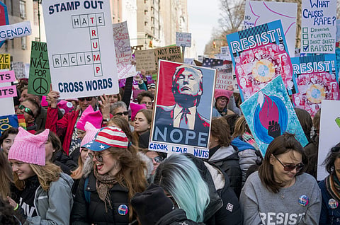 People take part in a rally portion of a march highlighting equal rights and equality for women. (Photo | AP)