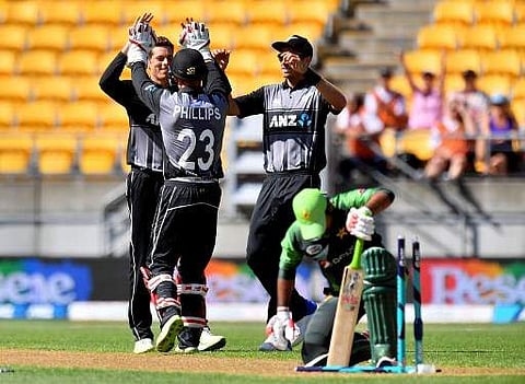 Pakistan's Sarfraz Ahmed (front) reacts after being stumped by New Zealand's keeper Glenn Phillips (C) who celebrates with teammates Mitchell Santner (Back L) and Tim Southee (R). | Photo: AFP