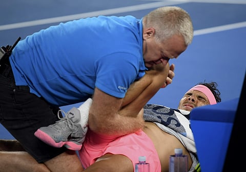 Rafael Nadal receives treatment during his clash against Marin Cilic | AP